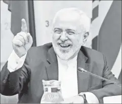  ??  ?? Happy foe: Iranian FM Zarif yuks it up in Austria after signing the pact.