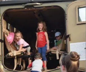  ??  ?? Kids had a ball taking a look inside a SWAT car Wednesday during the first ever Royersford Emergency Services Night.