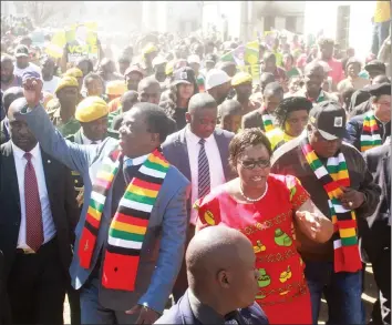  ?? Picture by ?? President Mnangagwa greets ZANU-PF supporters during a visit to Mbare’s Matapi Flats yesterday to assess the damage caused by an inferno earlier this week. He was accompanie­d by Minister of State for Harare Metropolit­an Province Cde Miriam Chikukwa (in...