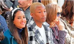  ??  ?? In this file photo, from left, Helen Lasichanh, her husband, Pharrell Williams, and French actress Isabelle Huppert attend the Chanel's Fall-winter 2016-2017 ready to wear collection presented in Paris. — AP