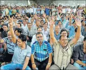  ?? PTI ?? Textile traders chant slogans during a protest against GST in Surat.