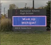  ?? STEPHEN FRYE — MEDIANEWS GROUP FILE PHOTO ?? Rochester Adams High School’s sign encourages mask use.