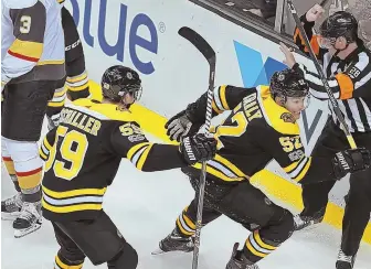  ?? STAFF PHOTO BY MATT STONE ?? THE WINNER: Sean Kuraly celebrates his third-period goal with Tim Schaller during the Bruins’ 2-1 win last night at the Garden.