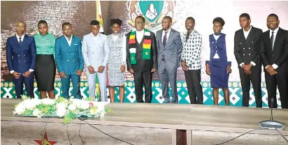  ?? ?? The President poses with students who are set to benefit from the ED UNZA Scholarshi­p programme at State House in Harare yesterday. – Picture: Kudakwashe Hunda