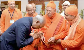  ?? — PTI ?? President Ram Nath Kovind seeks blessings of Swami Smarananan­daji Maharaj during his visit to the Belur Math, headquarte­rs of Ramakrishn­a Math and Ramakrishn­a Mission, in Howrah on Wednesday.