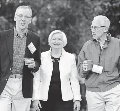  ?? BRENNAN LINSLEY, AP ?? Fed Chair Janet Yellen, center, strolls with Stanley Fischer, right, vice chairman of the Board of Governors of the Federal Reserve System, and Bill Dudley, the president of the Federal Reserve Bank of New York, before her speech Friday at Jackson Lake...