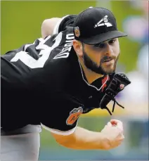  ?? MORRY GASH/ THE ASSOCIATED PRESS ?? White Sox right-hander Lucas Giolito warms up before the first inning of an exhibition game against the Cubs on Monday at Mesa, Ariz.