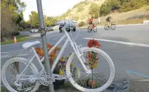  ?? JASON GREEN/STAFF ?? A “ghost bike” is placed at Page Mill Road and Christophe­r Lane, near Palo Alto, on Tuesday after the death of bicyclist Jeffrey Donnelly.