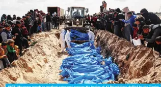  ?? — AFP ?? GAZA: Mourners watoh as medloal personnel prepare the bodies of 47 Palestinia­ns defiled by the Zlonist entity during a mass funeral in Rafah in the southern Gaza Strip on March 7, 2024.