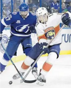  ?? CHRIS O'MEARA/AP ?? Florida Panthers defenseman Mark Pysyk (13) gets to the puck before Tampa Bay Lightning left wing Alex Killorn (17) during the second period.