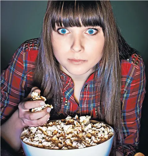  ??  ?? Snacking on popcorn has become increasing­ly common among women but Dr Pixie Mckenna, right, says it must never lead to the skipping of meals