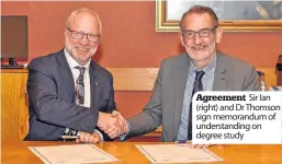  ??  ?? Agreement Sir Ian (right) and Dr Thomson sign memorandum of understand­ing on degree study