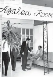  ?? FILE PHOTO COURTESY OF THE SAVANNAH MORNING NEWS ?? Officials at Levy’s Department Store in Savannah, Ga., ask a sit-down demonstrat­or to leave the store’s whites-only Azalea Room restaurant in 1960.