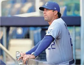  ?? KATHY WILLENS/AP ?? Royals manager Mike Matheny looks out from the dugout before a game against the Yankees on June 23, 2021, in New York.