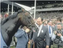  ?? Steve Powell/Allsport ?? Shergar with Aga Khan (centre) after winning the Irish Derby at The Curragh racecourse near Newbridge, County Kildare.