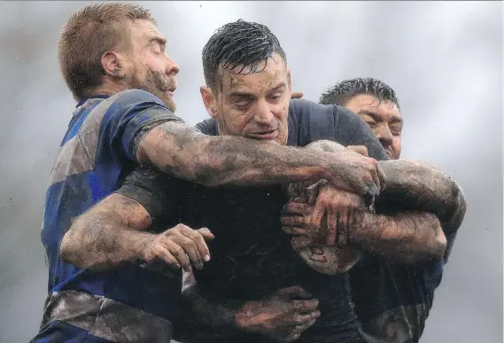  ?? CLINT HUGHES/THE CANADIAN PRESS ?? Craig Hall, centre, and his Toronto Wolfpack teammates will kick off play against the London Skolars in England’s third tier of rugby league on Saturday.