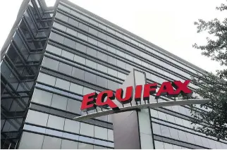  ?? MIKE STEWART/THE ASSOCIATED PRESS FILES ?? Canadian consumers say they have not received enough informatio­n or support compared with Americans after the Equifax breach that compromise­d personal informatio­n.