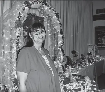  ?? KEVIN ADSHADE/THE NEWS ?? Jane Anne MacKinnon stands among some of the Nativity scenes at The Church of Jesus Christ of Latter-day Saints on Abercrombi­e Road.