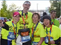  ??  ?? ABOVE: An ecstatic Nicola and fellow runners at the completion of the New York City Marathon.