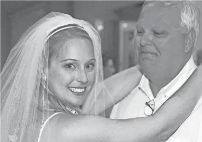  ?? JORDAN SHAMUS FAMILY PHOTO ?? Detroit Free Press health reporter Kristen Jordan Shamus dances with her father, Butch Jordan, at her April 19, 2002, wedding in Maui, Hawaii. Shamus held her father’s hand when he died
Aug. 10, 2016, of acute respirator­y distress syndrome (ARDS).