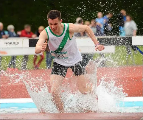  ??  ?? Enda Cloake of St. Peter’s College on his way to a fourth place finish in the Senior boys’ 2,000m steeplecha­se in Tullamore on May 30, 2015.