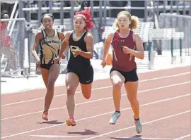  ?? Nick Koza For The Times ?? GARDENA SERRA’S Brazil Neal, middle, ran a 23.36-second 200-meter dash at the Masters Meet. “I just want to come here and stamp my name,” Neal said.