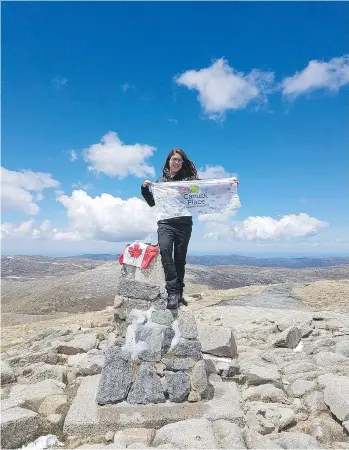  ?? LIZ ROSE/THE CANADIAN PRESS ?? Liz Rose poses at the top of Mount Kosciusko in Australia. From Everest to Denali, Rose has climbed to a record after spending more than two years scaling some of the tallest peaks on Earth.