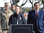  ?? DAVID SANTIAGO dsantiago@miamiheral­d.com ?? Florida’s Division of Emergency Management Director Jared Moskowitz, next to Florida Gov. Ron DeSantis, talks to the media at a press conference at a Broward County mobile testing site at C.B. Smith Park in Pembroke Pines on March 19.