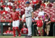  ?? JOHN MINCHILLO - THE ASSOCIATED PRESS ?? New York Mets’ Jay Bruce stands at the plate after umpire Gabe Morales called an out on the Mets for batting out of order earlier, in the first inning of a baseball game against the Cincinnati Reds, Wednesday, May 9, 2018, in Cincinnati.