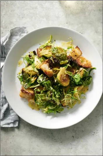  ?? ?? A lemony, garlicky salad, with roasted and shaved Brussels sprouts.