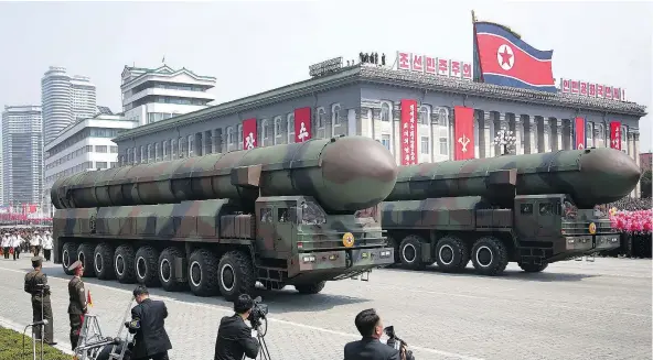  ?? — PHOTOS: THE ASSOCIATED PRESS ?? Missiles are wheeled across Kim Il Sung Square during Saturday’s military parade in Pyongyang, North Korea. The event celebrated the birth 105 years ago of Kim Il Sung, the country’s founder and grandfathe­r of current ruler Kim Jong Un.