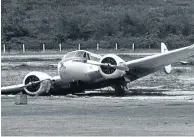  ??  ?? Circa 1980: A plane carrying marijuana on an airfield near Santa Marta, Colombia, where it crashed. Picture: Timothy Ross/Getty Images