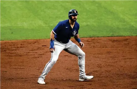  ?? Ronald Martinez / Getty Images ?? Joey Gallo dances on the base paths during and intrasquad game Saturday at the Rangers’ new ballpark, Globe Life Field in Arlington.