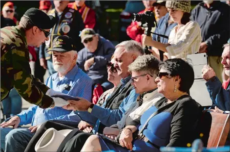  ?? DANA JENSEN/THE DAY ?? Merle Longnecker of New Rockford, N.D., is presented with a 48-star United States flag Saturday by Commander Brian Hague of the DAV Chapter 10 in Norwich, during the World War II Navy Plane Crash 75th Anniversar­y Memorial ceremony at the Preston Public Library. The ceremony was in memory of Longnecker’s uncle Ensign Merle Longnecker and Ensign George K. Kraus, who died when their Grumamn F6F5N U.S. Navy “Hellcats” collided during a training flight. The event was hosted by the Norwich Area Veterans Council.