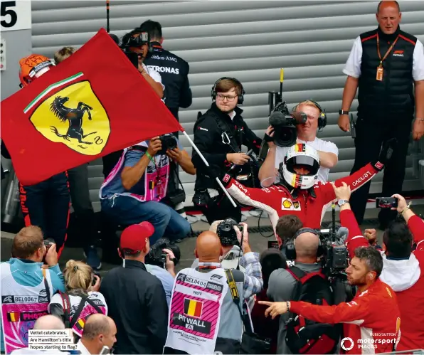  ??  ?? Vettel celebrates.Are Hamilton’s title hopes starting to flag?