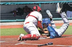  ?? CLYDE MUELLER/THE NEW MEXICAN ?? Portales catcher Joel Legarda, left, tags St. Michael’s Eric Romero at home plate Friday in the Class 4A State Baseball Tournament at the Santa Ana Star Field in Albuquerqu­e. St. Michael’s lost 4-3 in the semifinal, ending the Horsemen’s season. For...