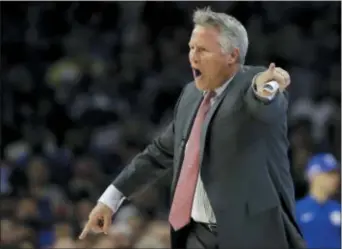  ?? MATT SLOCUM — THE ASSOCIATED PRESS ?? Sixers head coach Brett Brown, here yelling at his team Saturday in a Game 3 home loss to Boston, refused to blame his team’s 3-0 series deficit on the mistakes of youth. But he did admit it might have something to do with how they don’t match up well...