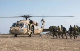  ??  ?? SOLDIERS CARRY a ‘wounded’ comrade to a helicopter during the exercise near Megiddo on Wednesday.