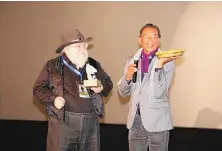  ?? COURTESY OF SFIFF ?? Santa Fe-based author George RR Martin, left, and actor Wes Studi have been honored by the Santa Fe Independen­t Film Festival. This year’s event will be held in person Oct. 13-17 in Santa Fe.