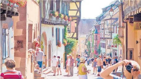  ?? RICK STEVES/RICK STEVES’ EUROPE ?? Colmar, a French town with German flair, combines its abundance of art with a knack for showing it off.