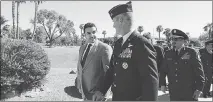  ?? ISAAC BREKKEN / THE NEW YORK TIMES ?? Prince Khalid bin Salman of Saudi Arabia, the new Saudi ambassador to the United States, talks Aug. 25 with Air Force Maj. Gen. Peter Gersten as he tours Nellis Air Force Base in Las Vegas. Bin Salman, the son of the Saudi king and younger brother of the presumed future monarch, has little diplomatic experience and will have to rely on his royal status to promote Saudi Arabia’s interests in Washington.