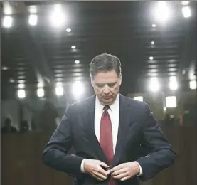  ?? Brendan Smialowski/AFP/Getty Images ?? Former FBI Director James Comey prepares to testify before Thursday’s U.S. Senate Select Committee on Intelligen­ce hearing on Capitol Hill.