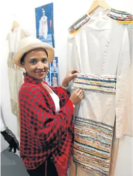  ?? Pictures: BARBARA HOLLANDS ?? HERITAGE: Yanela Mtolo links traditiona­l ideas, throwaway fabrics and a modern twist to conceptual­ise her range of clothing designs.