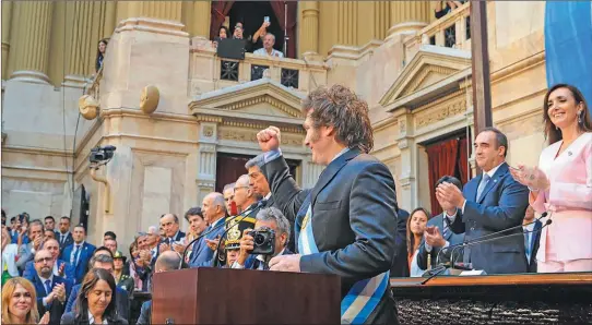  ?? NA ?? PUñO EN ALTO. El Presidente en uno de los tramos de su presencia en el Congreso para la apertura de sesiones ordinarias.