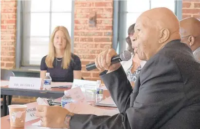  ?? KARL MERTON FERRON/BALTIMORE SUN ?? Dr. Christina D. Bethell of The Johns Hopkins Bloomberg School of Public Health listens to U.S. Rep. Elijah Cummings, a Maryland Democrat and the chairman of the Committee on Oversight and Reform, during a forum on childhood trauma at the offices of the nonprofit Humanim in Baltimore on Tuesday.