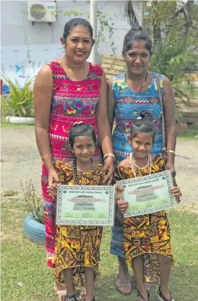  ??  ?? From left: Mineshni Permal and Ashna Devi with their daughters Nivritri Permal (left) and Ananya Nand at Gurunanak Khalsa Kindergart­en on 9th November, 2018