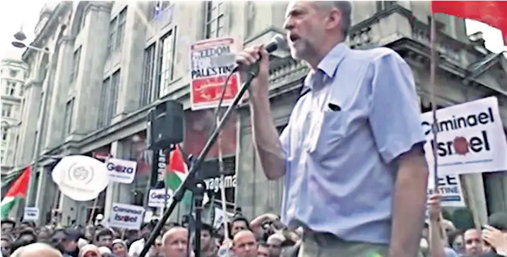  ??  ?? Jeremy Corbyn in 2010 outside the Israeli embassy in London suggesting to the assembled marchers and protesters that the blockade of Palestinia­n territory by Israel was comparable to a ‘type of war crime’