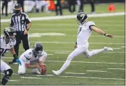  ?? AARON DOSTER — THE ASSOCIATED PRESS ?? Jacksonvil­le Jaguars kicker and Orland High grad Aldrick Rosas (7) kicks a field goal from the hold of Logan Cooke against the Cincinnati Bengals in the second half Sunday in Cincinnati.