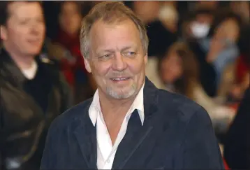  ?? YUI MOK/PA VIA AP, FILE ?? Actor David Soul arrives for the UK premiere of Starsky & Hutch at the Odeon Cinema in Leicester Square, central London, March 11, 2004. The actor who earned fame as the blond half of a crime-fighting duo in the popular 1970s television series “Starsky and Hutch” has died. David Soul was 80.