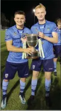  ??  ?? Arklow’s Daire O’Connor and Liam Scales celebrate after helping UCD to the First Division crown.